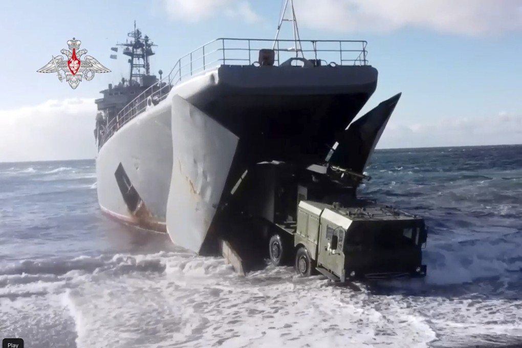 A photo released by the Russian Defence Ministry shows a Bastion missile launcher moving ashore from an amphibious landing vehicle on Matua Island, part of the Kuril Islands chain, in December 2021. Photo: AP