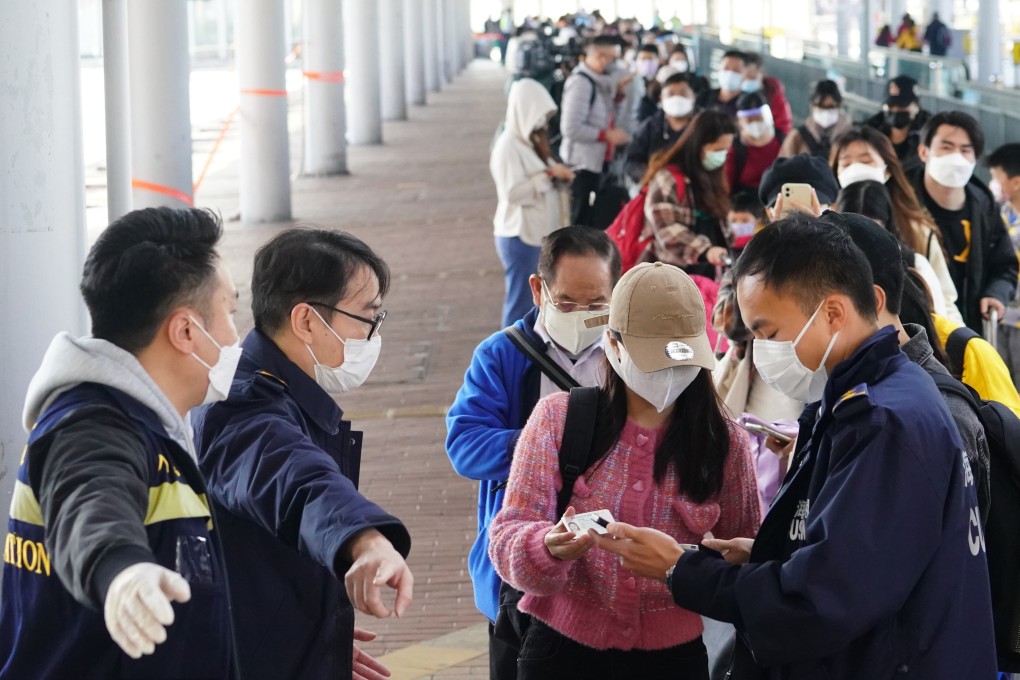 Cross-border travellers queue at Shenzhen Bay Control Point to enter mainland China, as Hong Kong battles its fifth and worst Covid-19 wave so far. Photo: Felix Wong
