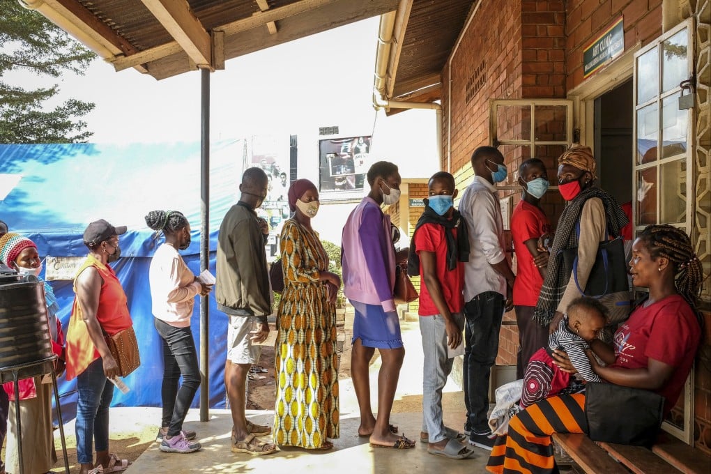 Ugandans queue to receive Pfizer coronavirus vaccines at the Kiswa Health Centre III in the Bugolobi neighborhood of Kampala, Uganda, on February 8. As long as Covid-19 is still spreading somewhere in the world, then it has the chance to mutate. Photo: AP