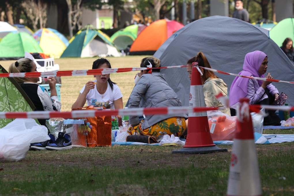 Foreign domestic helpers on their day off at a park in Tseung Kwan O on January 9. Photo: Nora Tam