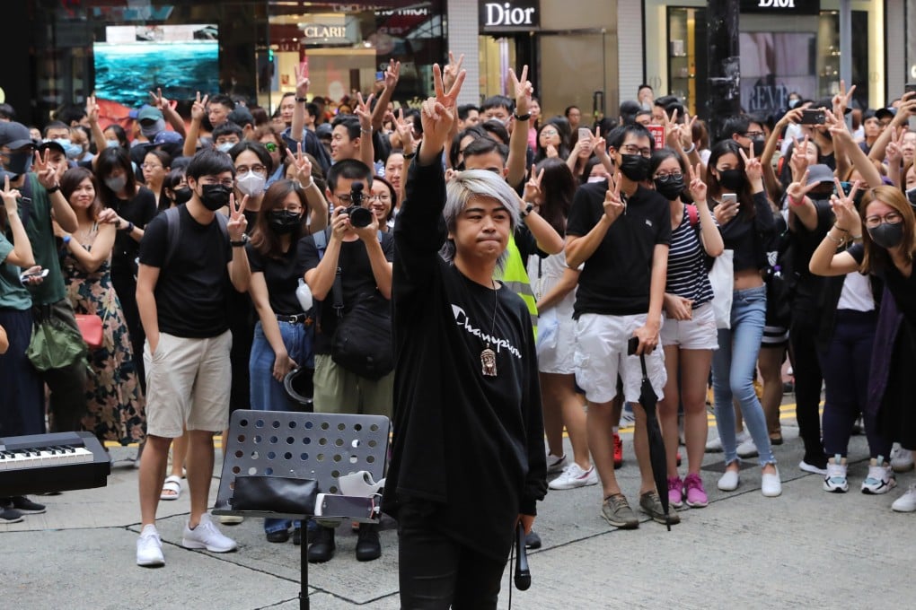 Singer Tommy Yuen performs for anti-government protesters in Causeway Bay in 2019. Photo: May Tse