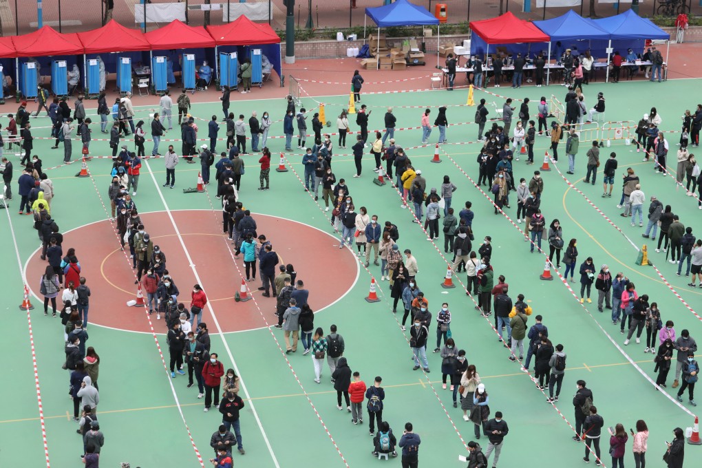 Residents and workers subject to compulsory testing queue at a mobile specimen collection station in Yuen Long. Photo: Jelly Tse