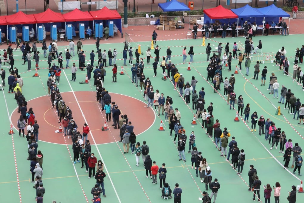 Residents and workers subject to compulsory testing queue at a mobile specimen collection station in Yuen Long. Photo: Jelly Tse
