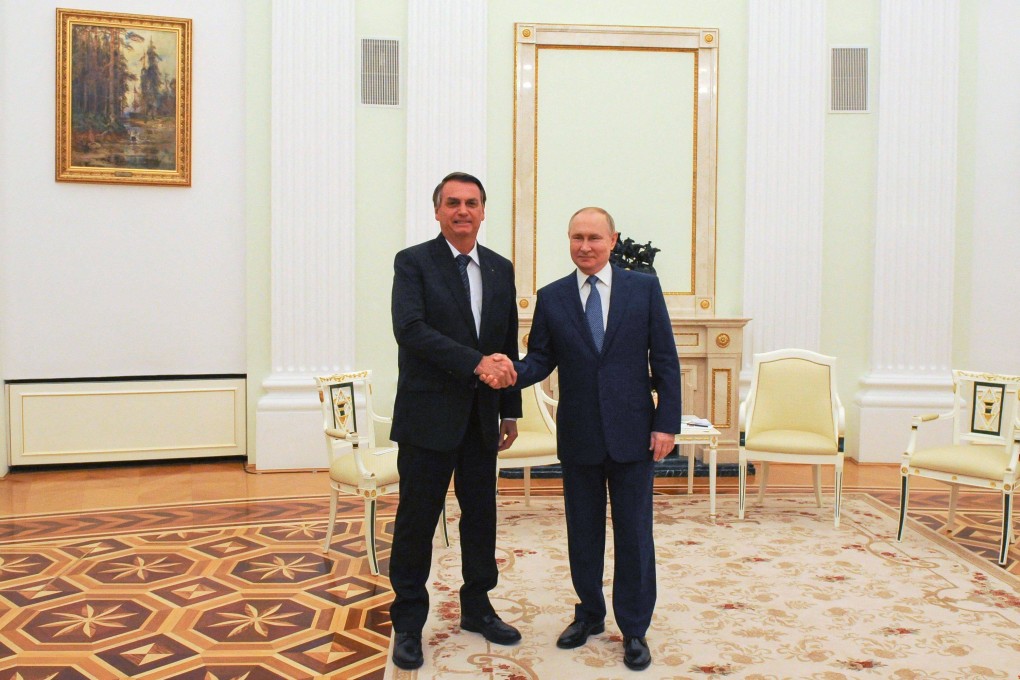 Russian President Vladimir Putin, right, shakes hands with Brazil’s President Jair Bolsonaro at the Kremlin in Moscow on February 16. Photo: Sputnik / AFP