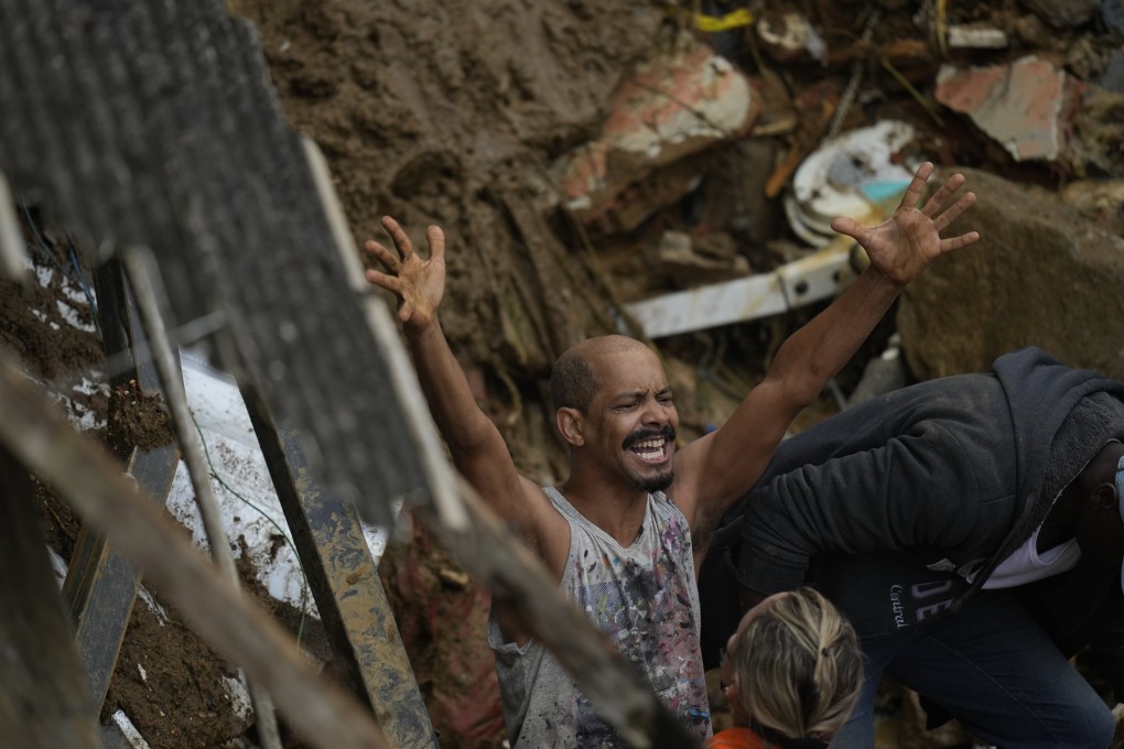 A resident yells during the search for survivors after fatal mudslides in Petropolis, Brazil. Photo: AP