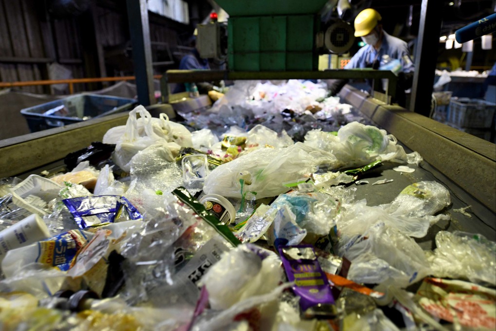 This picture taken May 2018 shows workers sorting disposable garbage in Narashino, Chiba prefecture. Photo: AFP Toshifumi KITAMURA