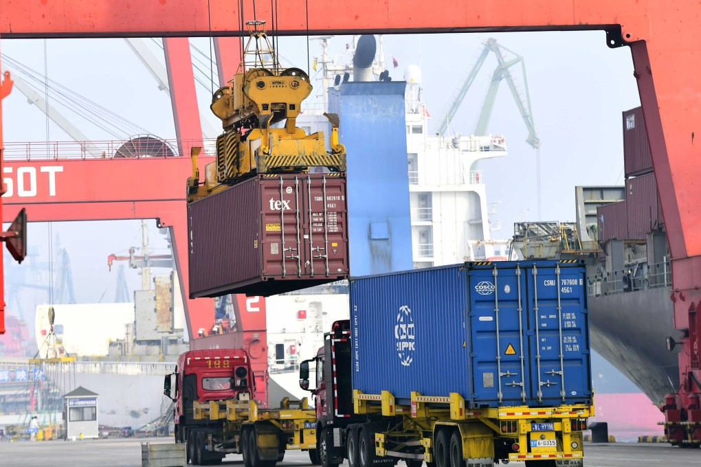 A container is loaded onto a truck at a port in east China’s Shandong Province last month. Photo: Xinhua