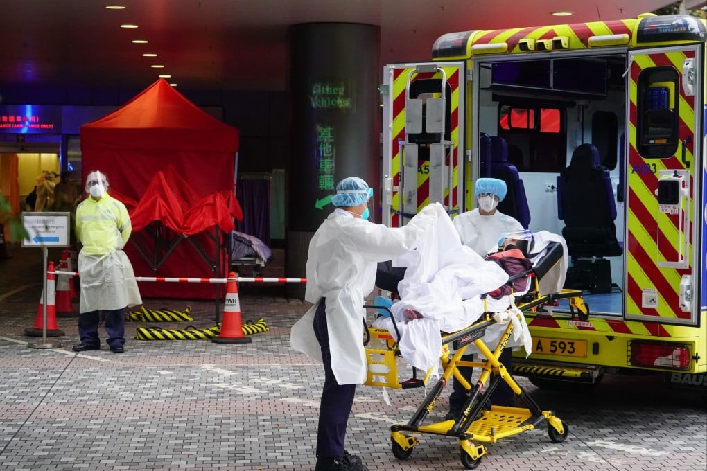 Patients with Covid-19 symptoms wait at a temporary holding area outside Prince of Wales Hospital in Sha Tin on February 18, 2022.
Photo: SCMP/Felix Wong