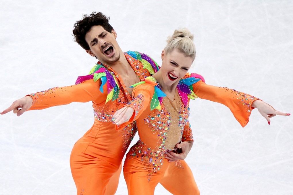 Paul Poirier (left) and Piper Gilles, of Canada, rock dazzling orange jumpsuits as they perform their routine during the ice dance competition at the 2022 Winter Olympics, in Beijing. Photo: Reuters