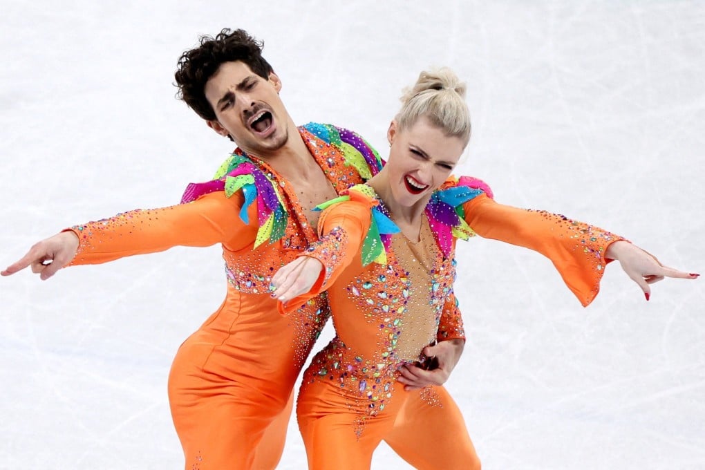 Paul Poirier (left) and Piper Gilles, of Canada, rock dazzling orange jumpsuits as they perform their routine during the ice dance competition at the 2022 Winter Olympics, in Beijing. Photo: Reuters