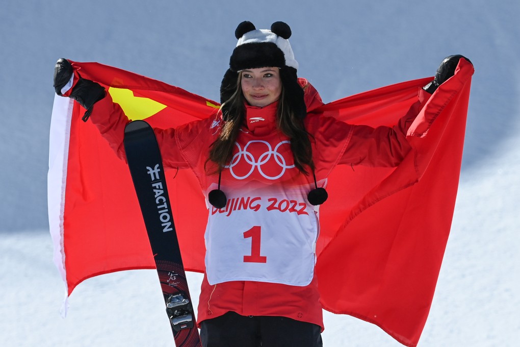 Gold medallist Eileen Gu, of Team China, poses with the national flag after winning her second gold. Photo: DPA