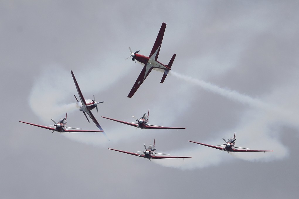 The Indonesian Air Force’s Jupiter Aerobatic Team takes part in an aerial display during the Singapore Airshow on February 15. Photo: AP