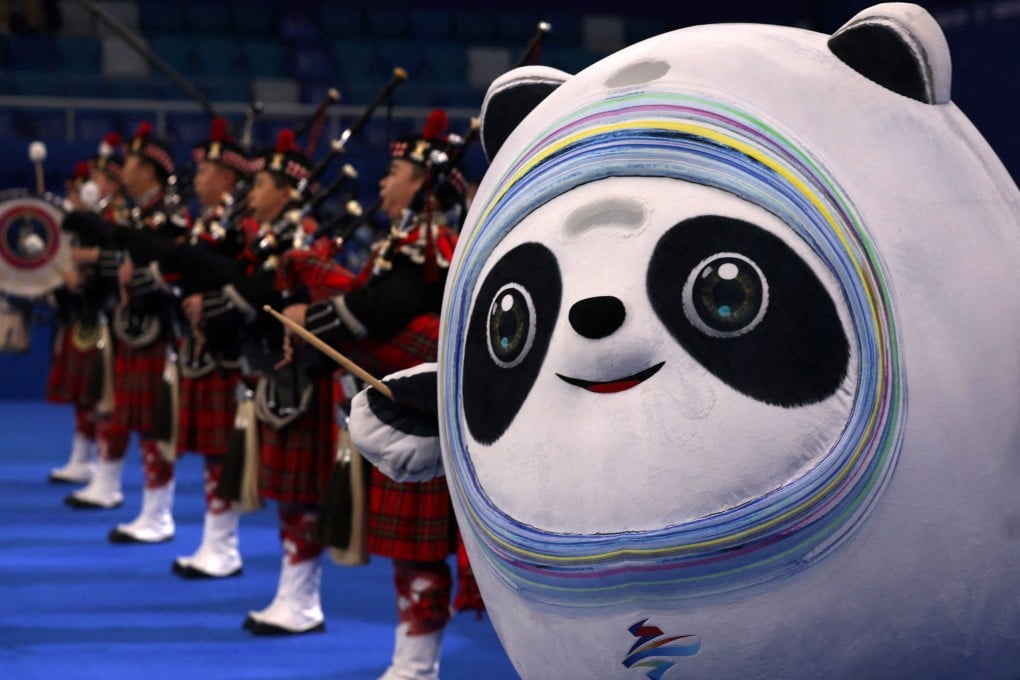 Bagpipers and Bing Dwen Dwen, the mascot for the 2022 Winter Olympics, perform before men’s curling bronze medal game between Canada and the United States. Photo: Reuters