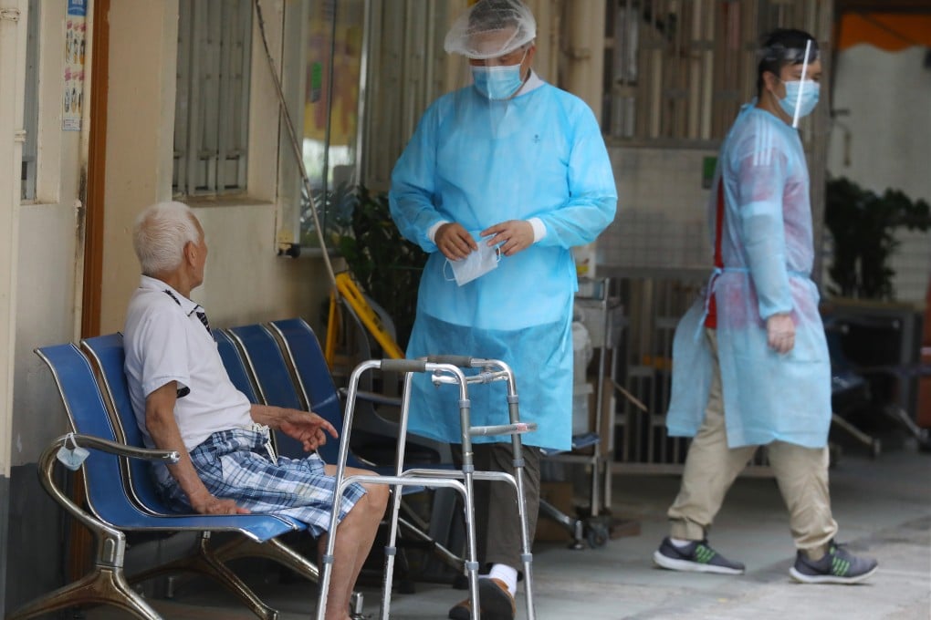 Medical workers take care of a elderly man at a care home in Tuen Mun. Photo: Dickson Lee