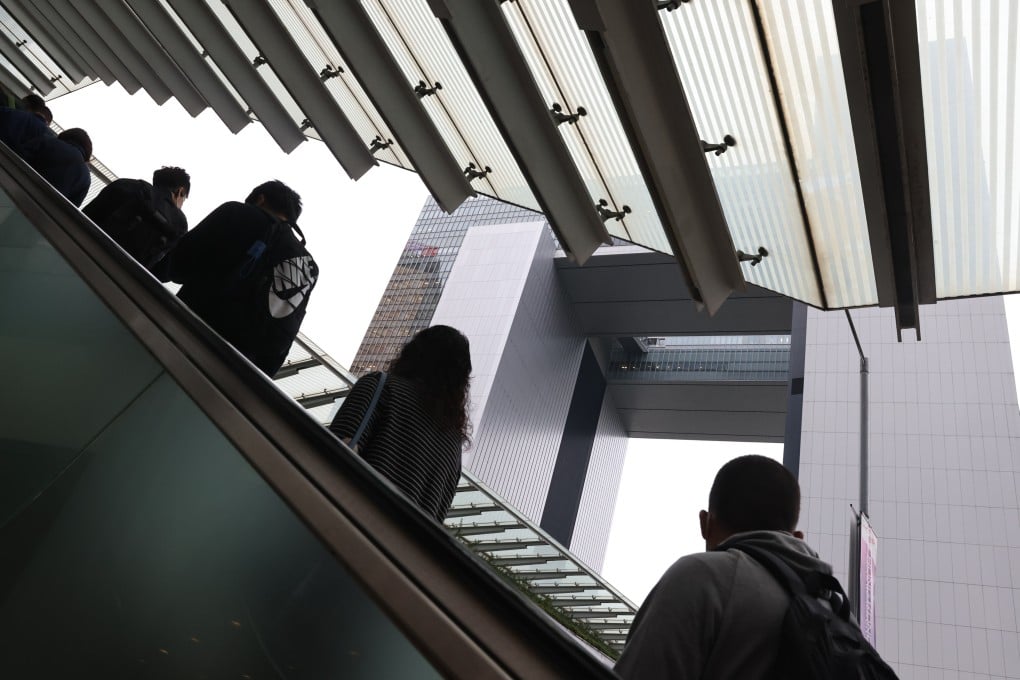 Civil servants head to work at Central Government Offices. Hong Kong civil servants will be enlisted for three months to help the city’s Covid-19 fight, sources have said. Photo: K. Y. Cheng