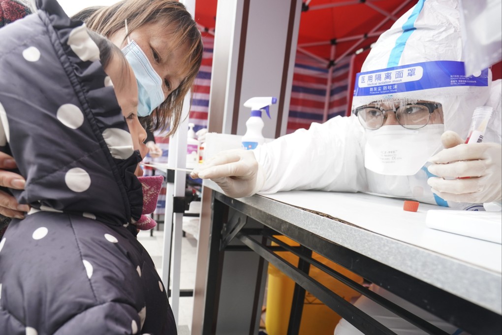 A child takes a Covid-19 test in Suzhou on Friday. Photo: Xinhua
