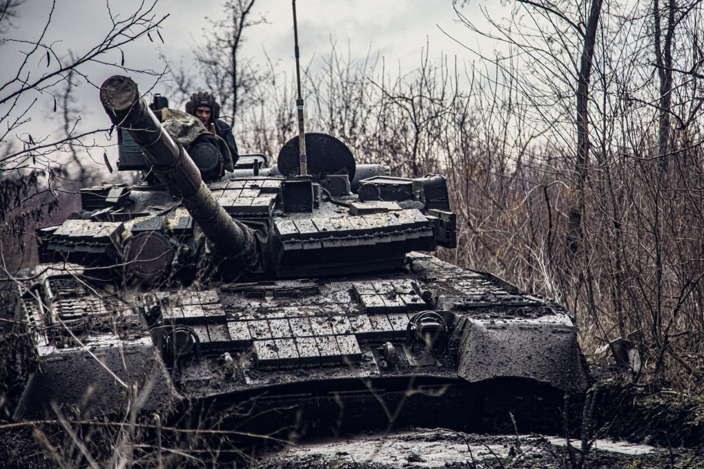 A Ukrainian Naval Infantry Corps soldier rides a tank during drills at a training ground at an unknown location in a picture released on Friday. Photo: Ukrainian Naval Forces via Reuters