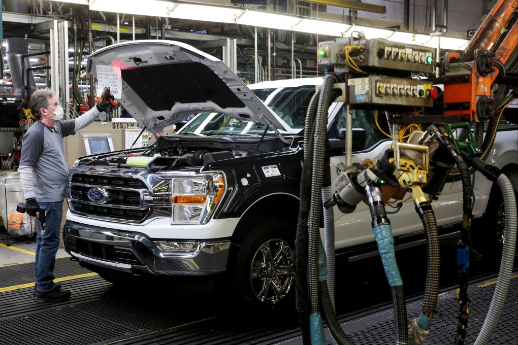 An assembly worker of Ford Motor works on an F-series pickup truck at the Dearborn Truck Plant in Dearborn, Michigan on January 26, 2022. Photo: Reuters