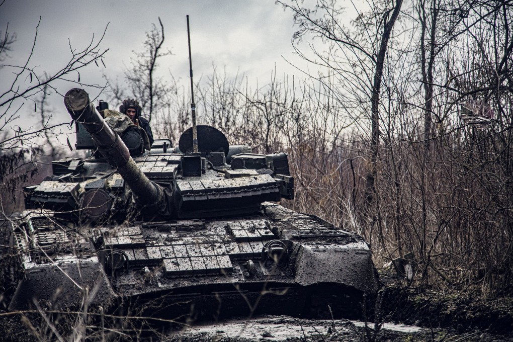 A service member of the Ukrainian Naval Infantry Corps (Marine Corps) rides a tank during drills at a training ground in an unknown location in Ukraine. Photo: Press Service of the Ukrainian Naval Forces/Handout via Reuters