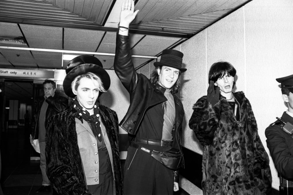 Nick Rhodes (L1) and John Taylor (C), members of the rock group Duran Duran, arriving at Kai Tak Airport. 23FEB89 SCMP / Chu Ming-hoi