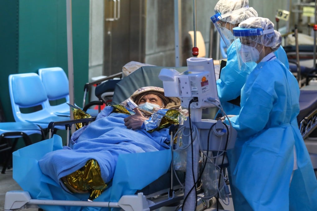 Covid-19 patients wait at a temporary outdoor isolation area at Caritas Medical Centre in Sham Shui Po. Photo: Yik Yeung-man
