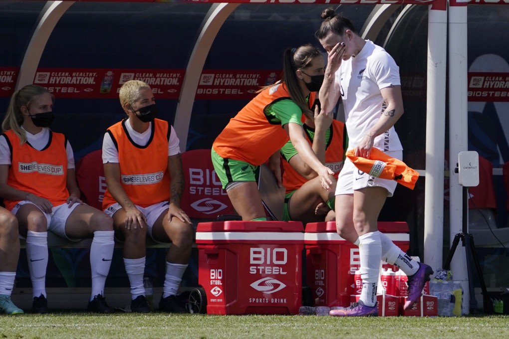 New Zealand defender Meikayla Moore wipes her face as she walks to the bench. Photo: AP