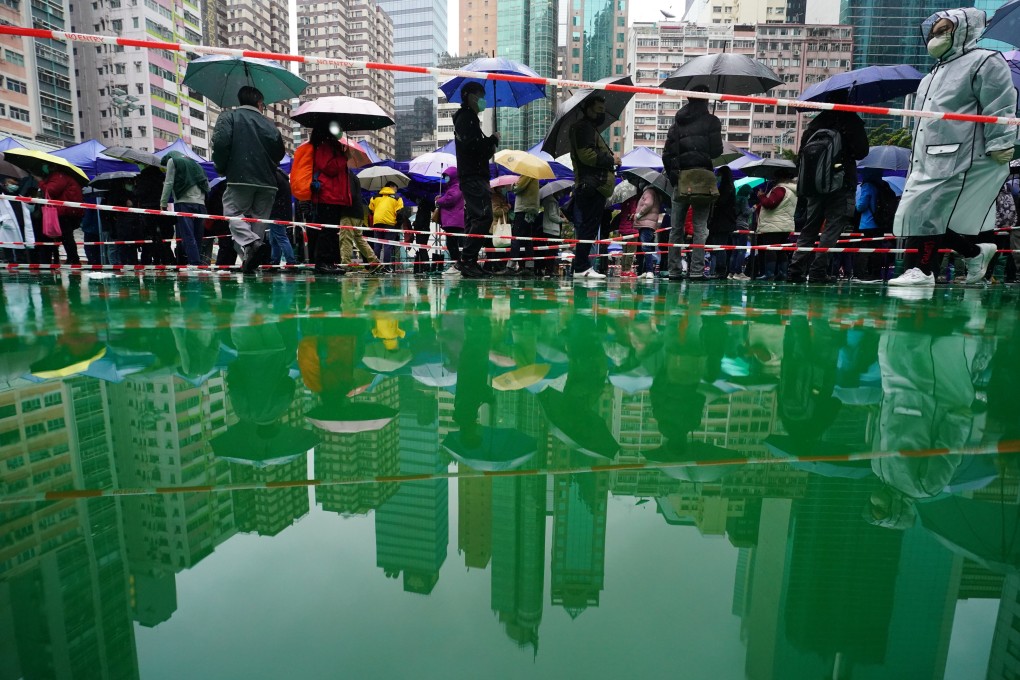 People line up to get tested for Covid-19 in Hong Kong, where more than 7,500 cases were reported on Monday. Photo: Felix Wong