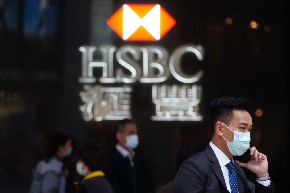 People walk past a HSBC branch in Central. Photo: Sam Tsang
