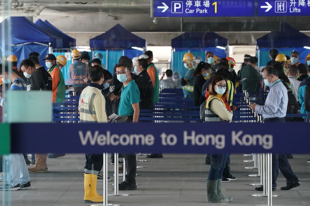 People queue at compulsory Covid-19  testing centres at Terminal 1, Hong Kong International Airport, Chek Lap Kok. SCMP writer Stephen McCarty recently encountered Hong Kong red tape at it’s worst at the airport. Photo: Felix Wong