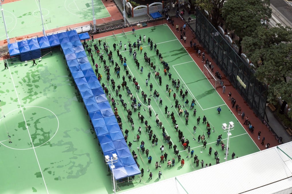 Hongkongers queue to take Covid-19 tests on February 23. Hong Kong will conduct compulsory testing of its entire 7.4 million population in March. Photo: Bloomberg