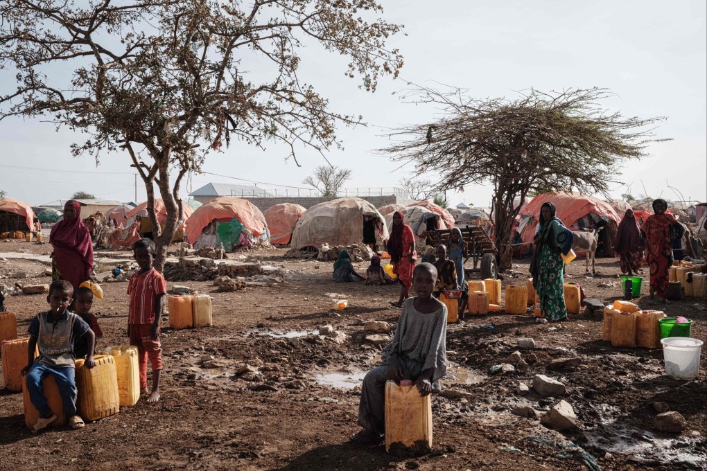 People wait for water at one of the 500 camps for internally displaced persons in Baidoa, Somalia. China has appointed an envoy to the Horn of Africa to pursue “peace and security and embrace development and prosperity” for nations there. Photo: AFP