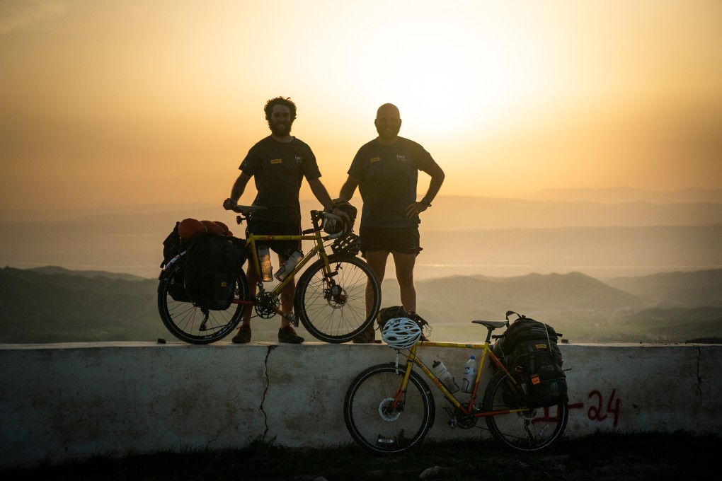 James Owen and Ron Rutland in Tajikistan as they cycle from London to Japan for the Rugby World Cup. Rutland is cycling from Japan to Auckland and Paris for the next Rugby World Cups. Photo: DHL Race to Rugby World Cup