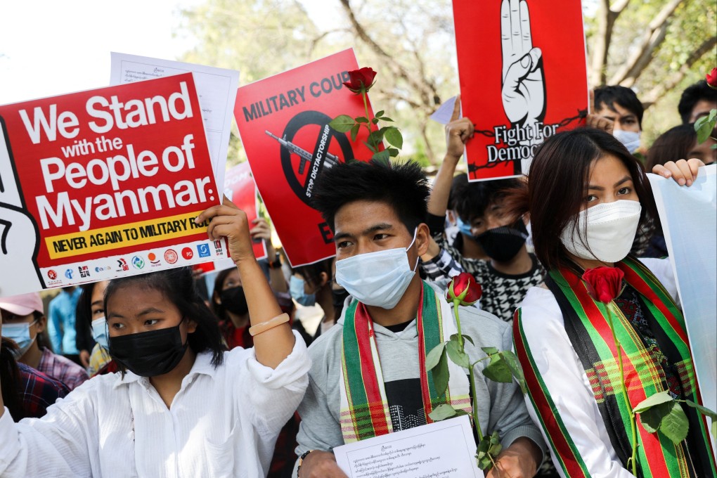 Myanmar nationals in India hold placards at an anti-coup protest. Photo: Reuters