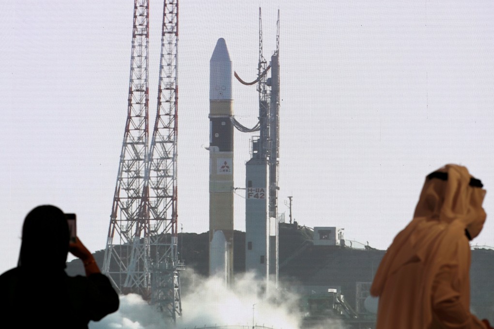 People view a screen displaying the booster rocket of the Hope Probe ahead of its launch from Tanegashima Island in Japan in July 2020. Photo: Reuters