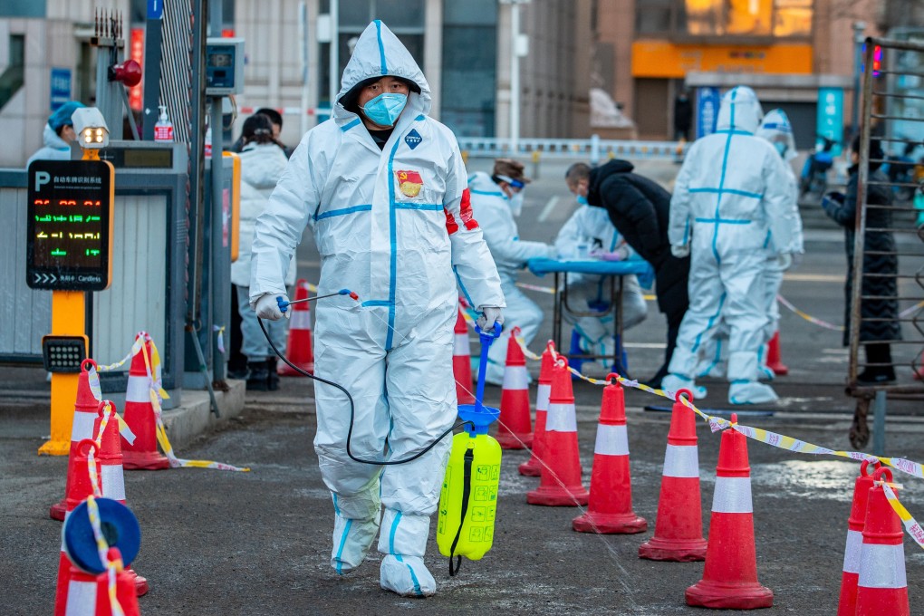 Volunteers disinfect a testing site in Hohhot, Inner Mongolia. Photo: Future Publishing via Getty Images