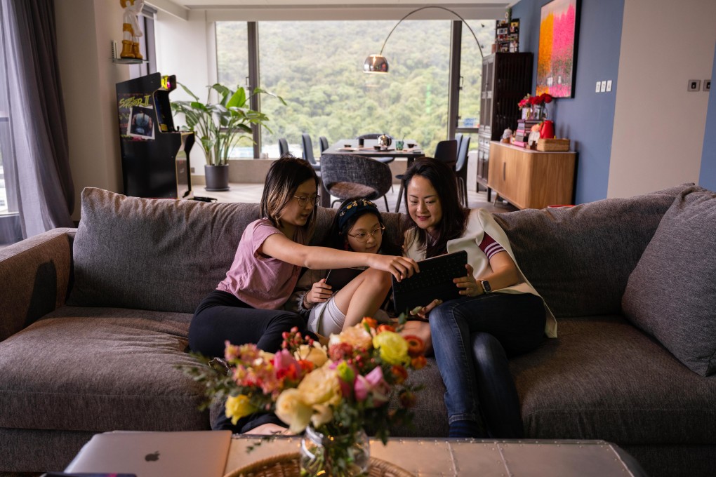 Arcadia Kim, founder of Infinite Screentime, plays Minecraft with her daughters in Hong Kong on February 19, 2022. Photo: Bloomberg