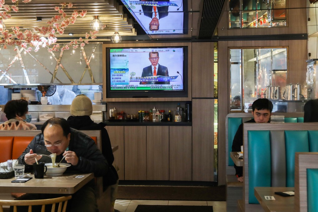 Financial Secretary Paul Chan Mo-po on the TV screen delivering the 2022-23 budget via video on February 23, 2022. Photo: Yik Yeung-man