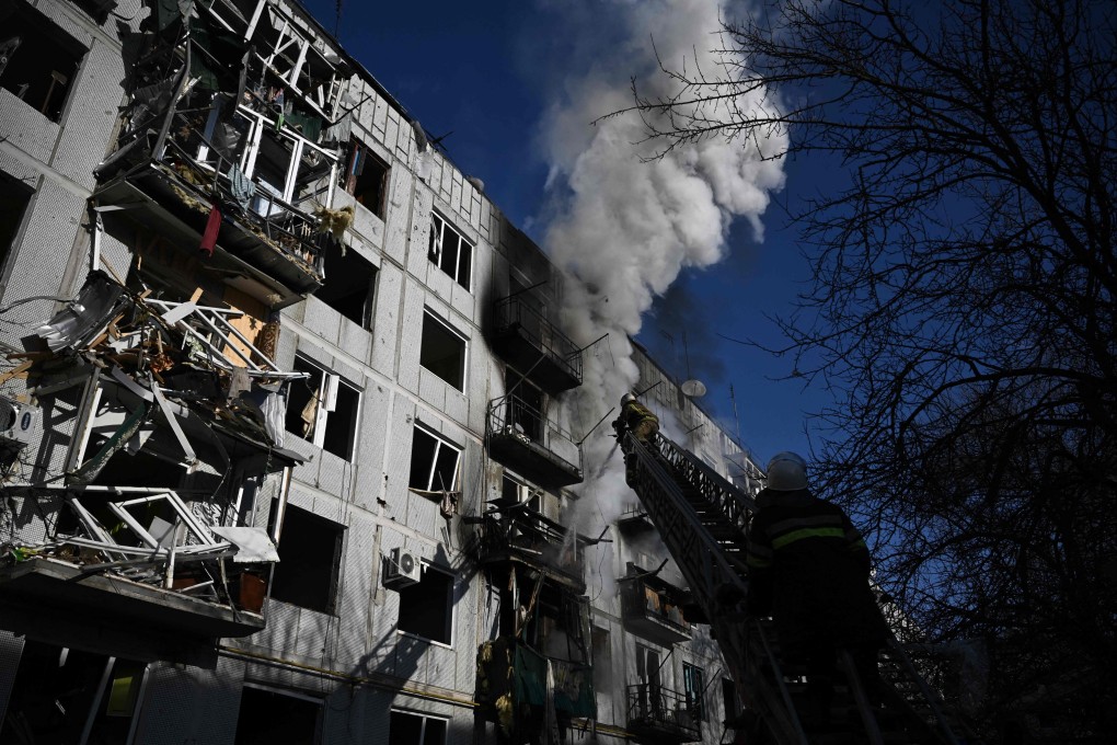 Firefighters battle to extinguish a blaze at a building after bombings on the eastern Ukrainian town of Chuguiv on Thursday. Photo: AFP