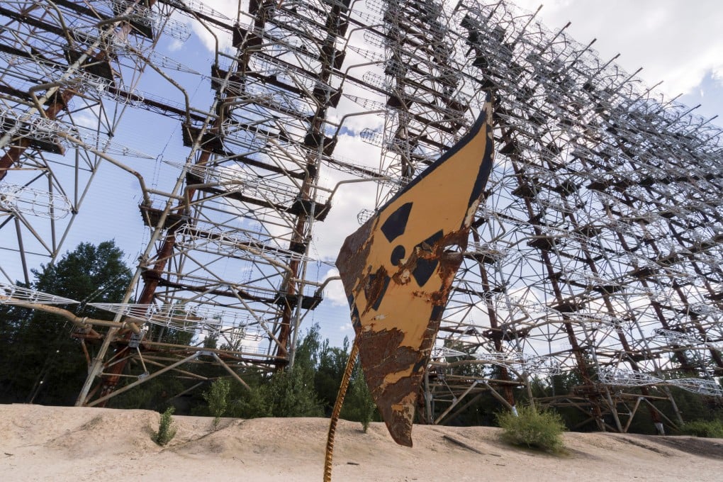 A rusty radioactivity warning sign is displayed in the Chernobyl exclusion zone in Ukraine in June 2019. Photo: Bloomberg