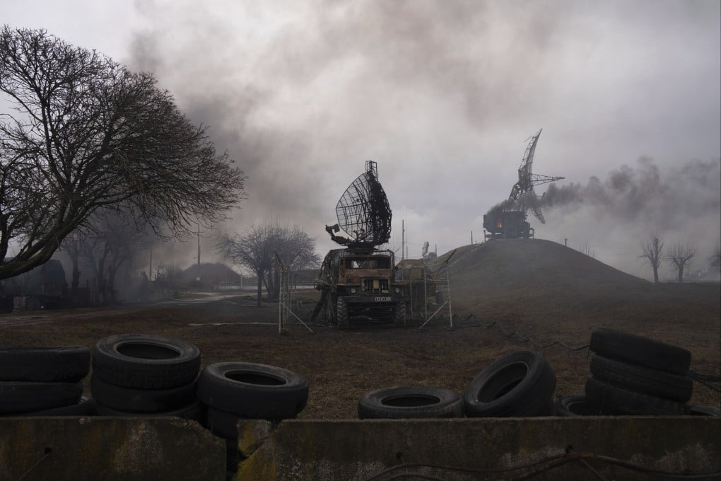 Smoke rises from an air defence base in the aftermath of an apparent Russian strike in Mariupol, Ukraine. Photo: AP