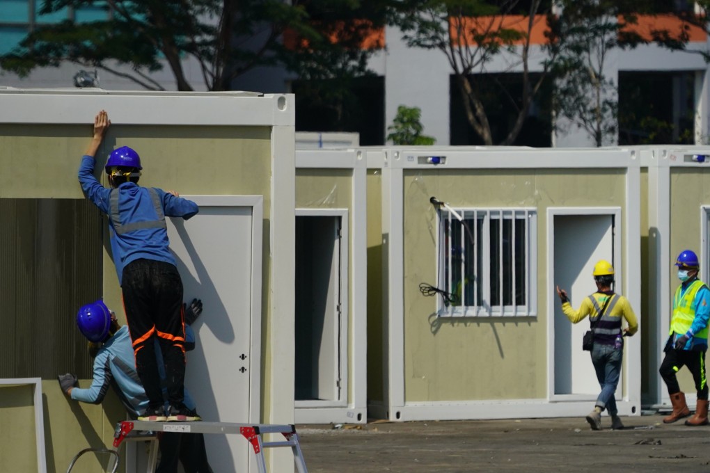 Workers build a mobile cabin hospital in Tsing Yi. Photo: Felix Wong