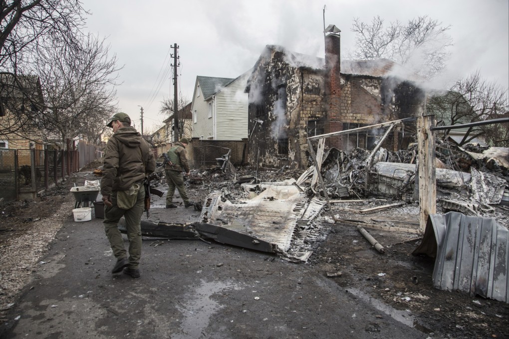Ukrainian servicemen walk at fragments of a downed aircraft seen in in Kyiv on Friday. Chinese social media platforms said they are cracking down on misinformation and other inappropriate content about Russia’s invasion of Ukraine. Photo: AP Photo