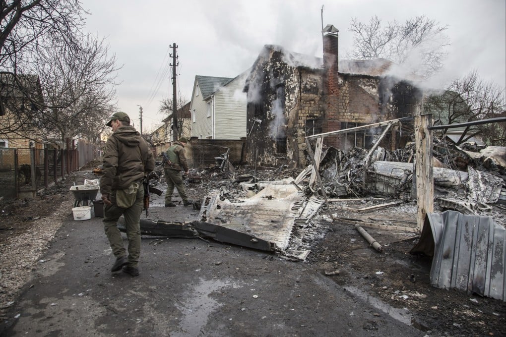 Ukrainian servicemen walk at fragments of a downed aircraft seen in in Kyiv on Friday. Chinese social media platforms said they are cracking down on misinformation and other inappropriate content about Russia’s invasion of Ukraine. Photo: AP Photo