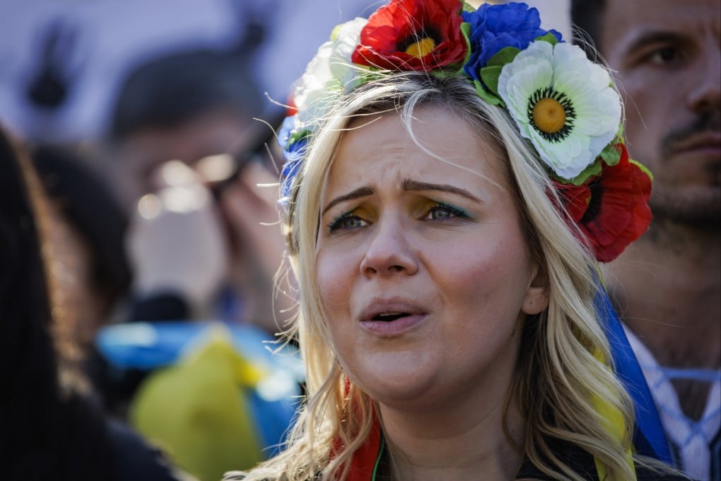 A demonstrator sings the Ukraine national anthem during a protest against the Russian invasion of Ukraine in Washington, US, on Sunday. Photo: Bloomberg