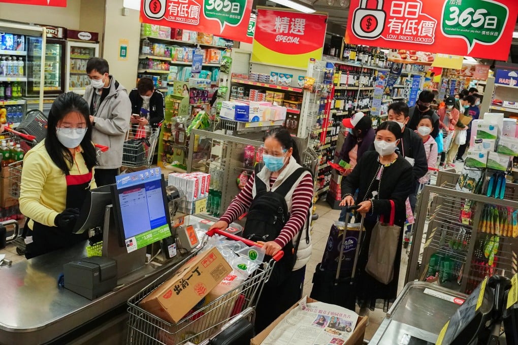 People queue up to buy food from a supermarket in Sham Shui Po. Photo: SCMP/Felix Wong