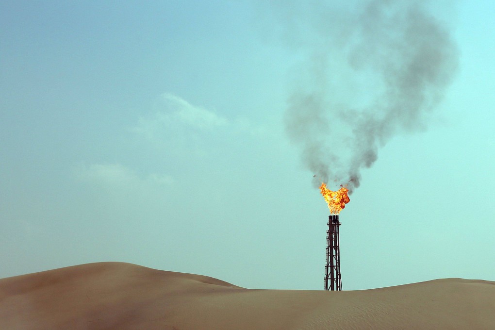 A flare from a gas well is seen in Qatar. Photo: AFP