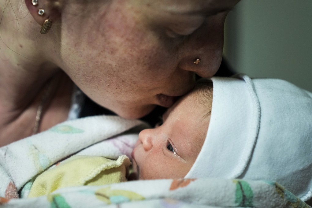 Kateryna Suharokova kisses her newborn son Makar in the basement of a maternity hospital converted into a medical ward and used as a bomb shelter in Mariupol, Ukraine, on Monday. Photo: AP
