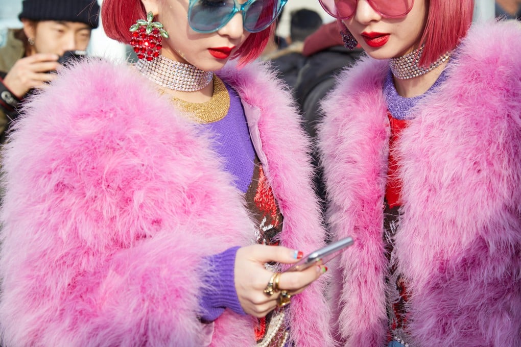 Asian influencers wear pink fur coats at a Gucci fashion show during Milan Fashion Week, in Milan, Italy. Demand for fur has fallen in many Western countries, and some have banned fur farming. Photo: Shutterstock
