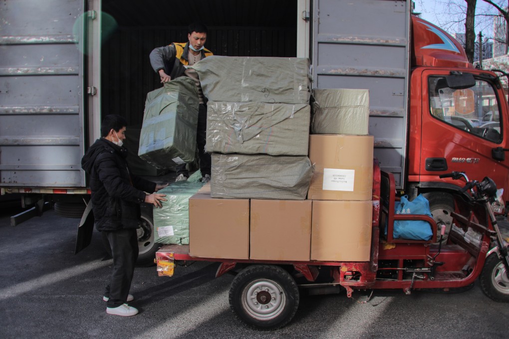Workers unload goods from a truck near a trading centre known as the Russian Market in Beijing on Tuesday. China says it hopes to maintain normal trade relations with both Ukraine and Russia. Photo: EPA-EFE