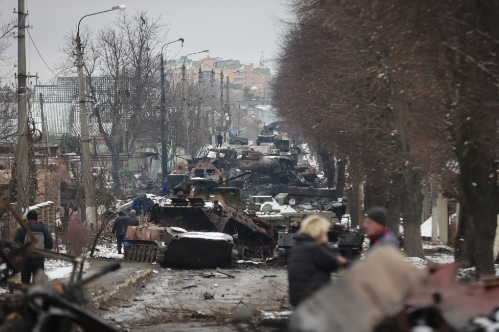 The gutted remains of Russian military vehicles on a road in the town of Bucha, close to the capital Kyiv, Ukraine on Tuesday. Photo: AP
